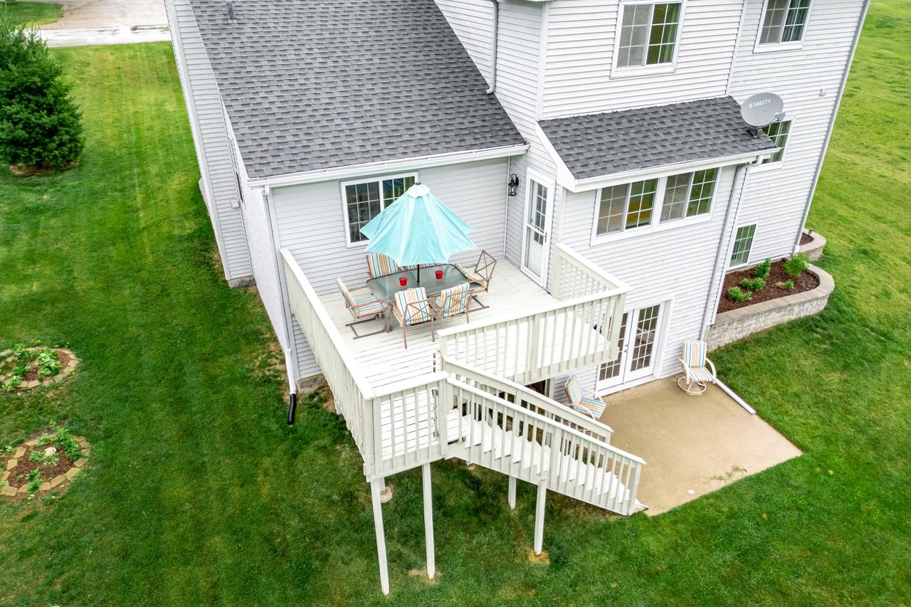2108 Lake Summerset Road Lake Summerset, IL 61019 - Photo 40 of 53 a view of a house with a yard and deck