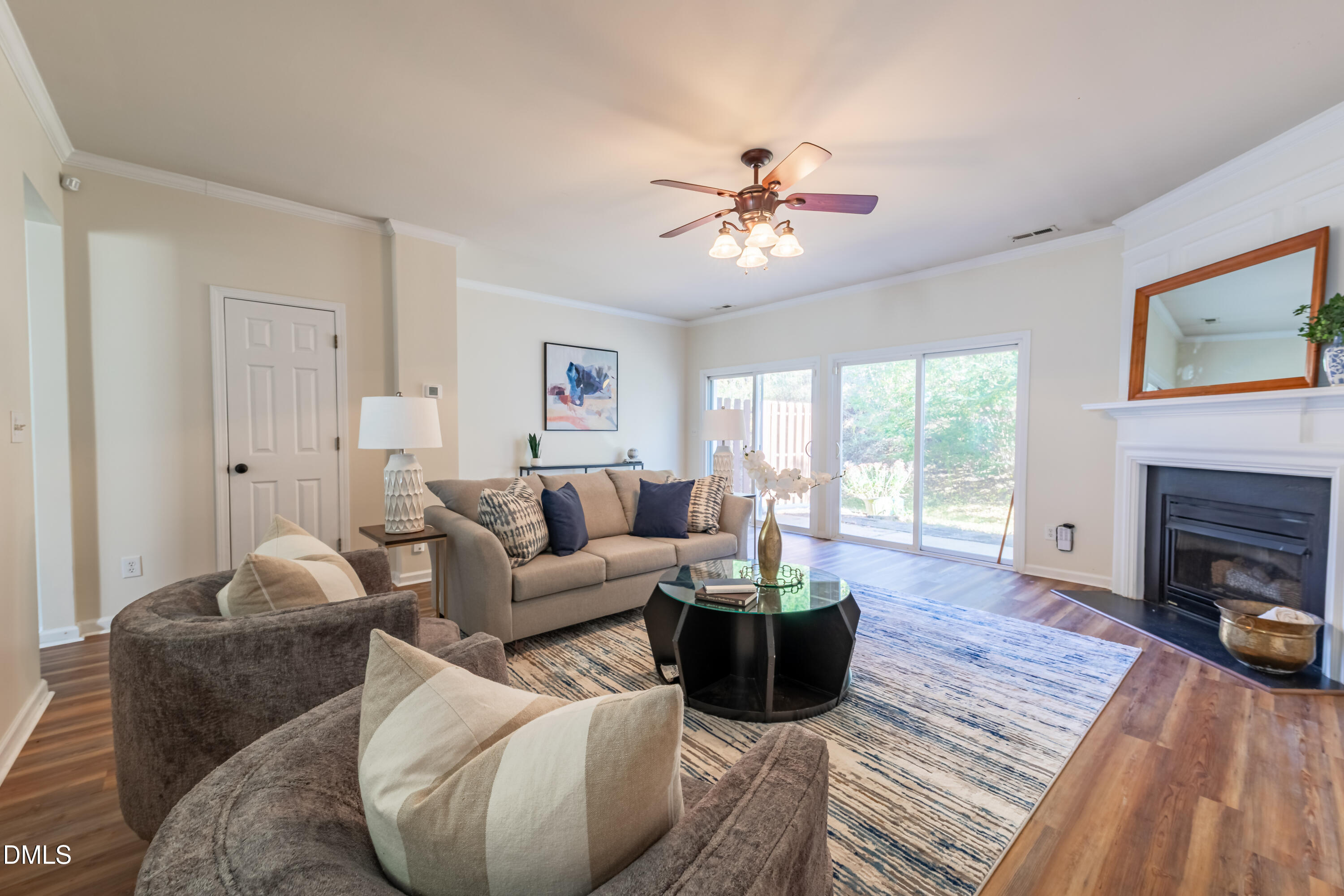5209 Echo Ridge Road Raleigh, NC 27612 - Photo 1 of 16 a living room with furniture a fireplace and a table