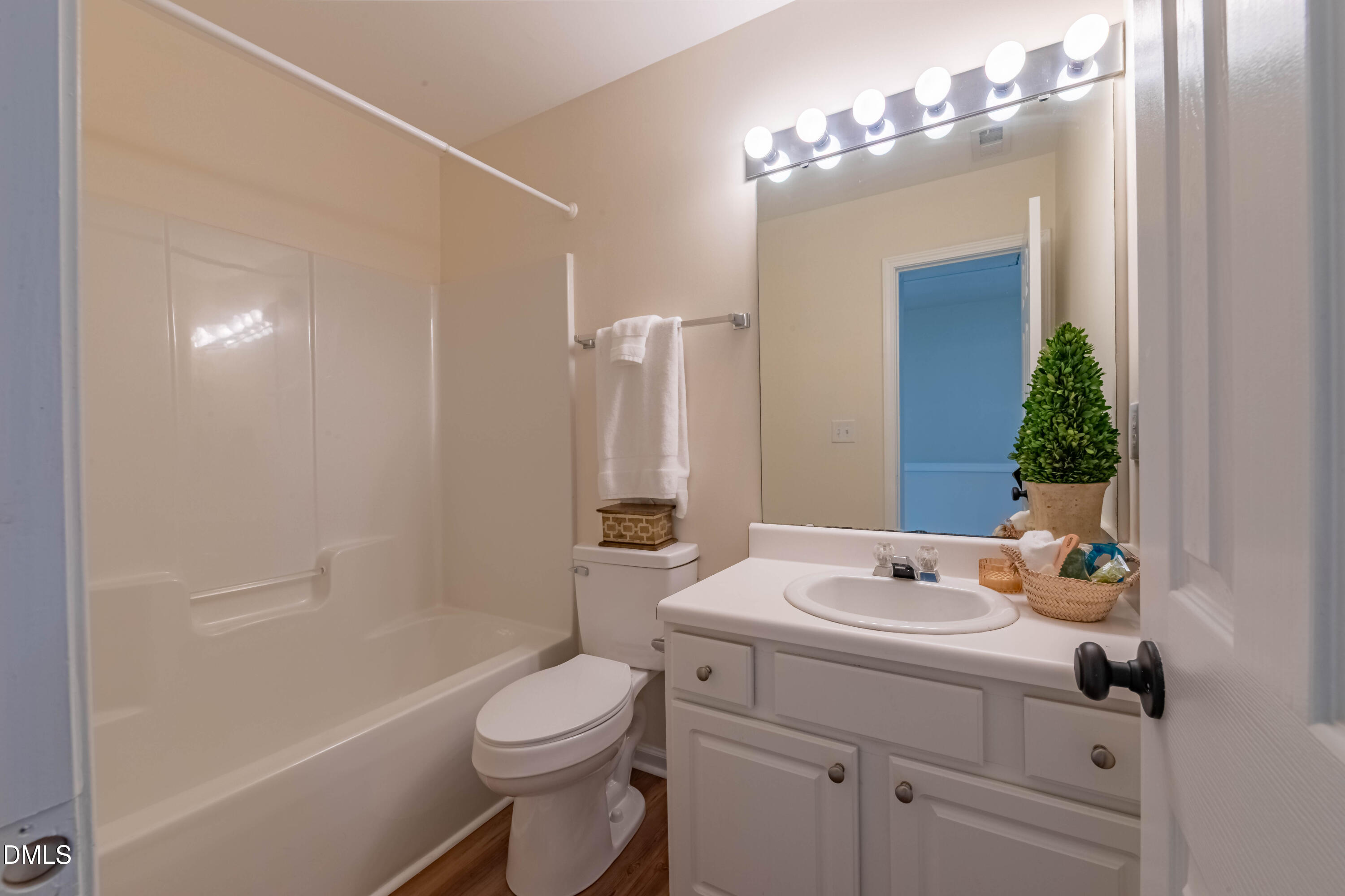 5209 Echo Ridge Road Raleigh, NC 27612 - Photo 13 of 16 a bathroom with a sink a toilet and shower