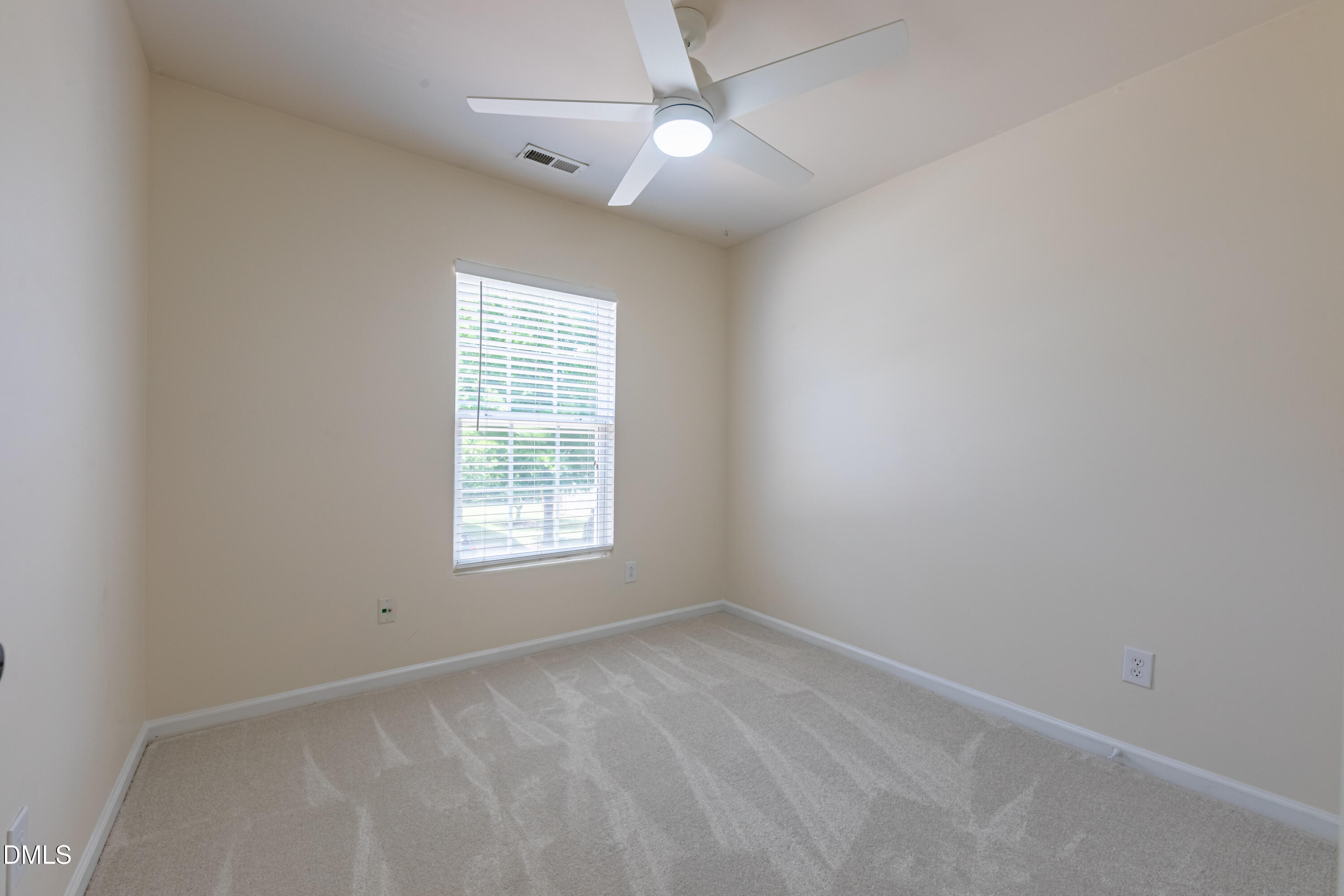 5209 Echo Ridge Road Raleigh, NC 27612 - Photo 15 of 16 an empty room with a window