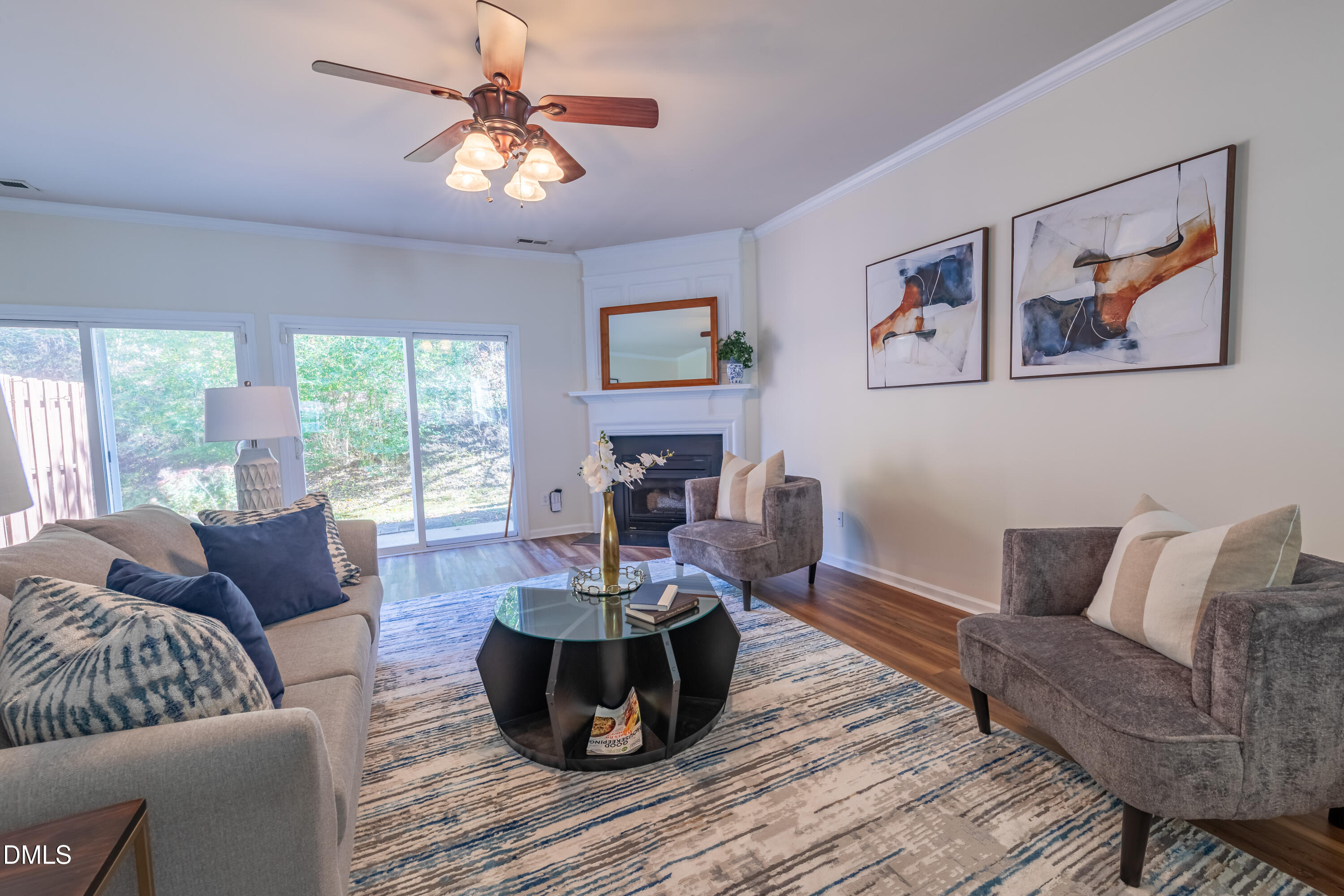 5209 Echo Ridge Road Raleigh, NC 27612 - Photo 4 of 16 a living room with furniture and a wooden floor
