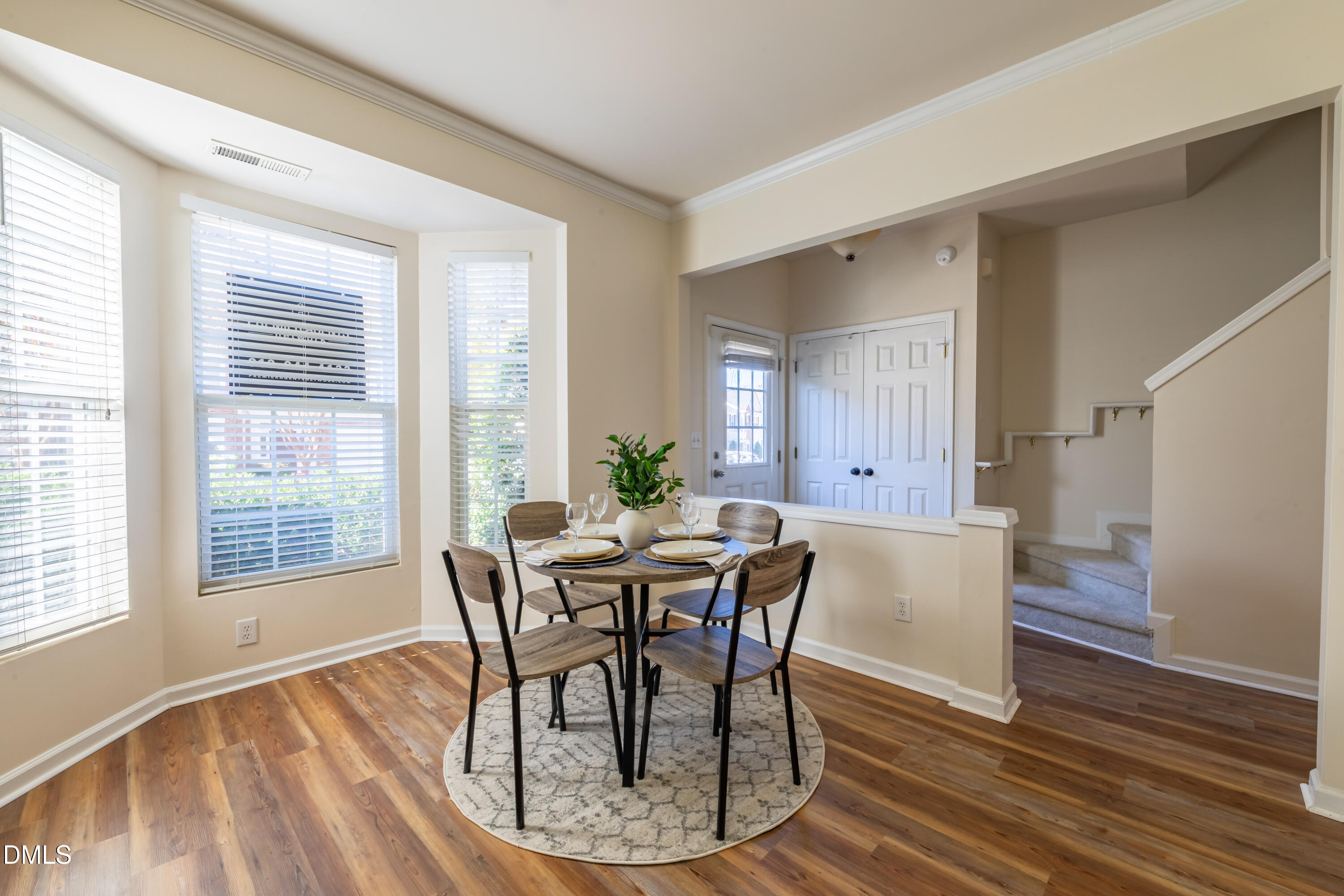 5209 Echo Ridge Road Raleigh, NC 27612 - Photo 6 of 16 a view of a dining room with furniture window and wooden floor