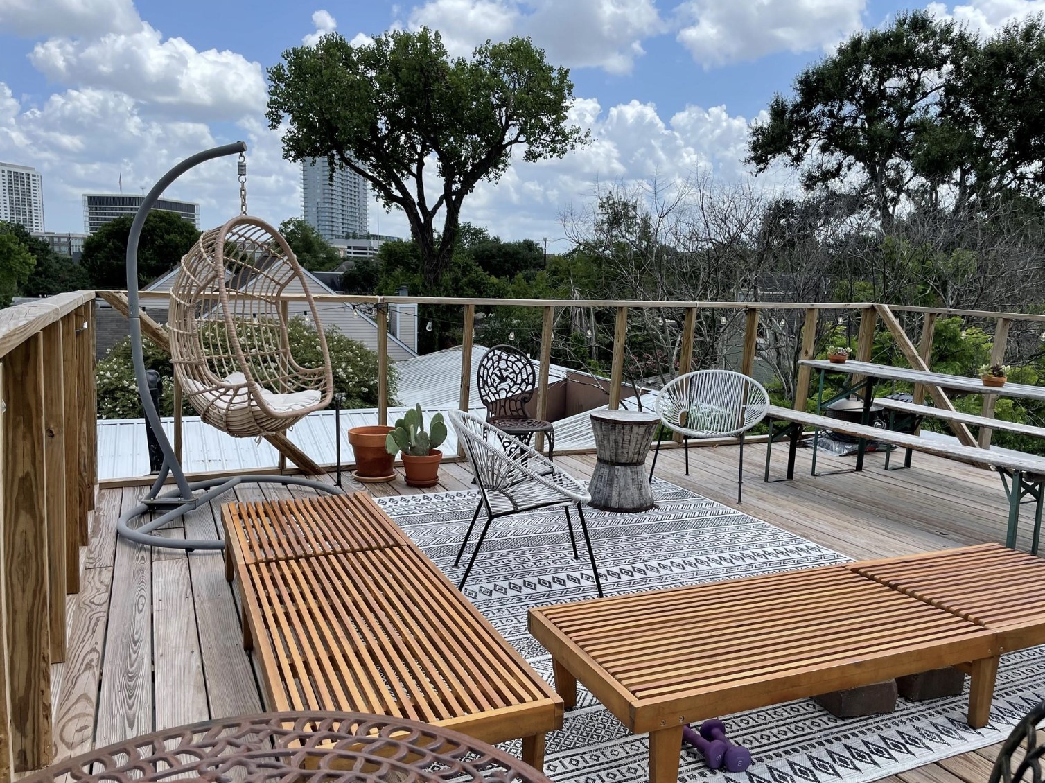 429 Hawthorne Street Houston, TX 77006 - Photo 29 of 35 a view of a roof deck with wooden floor and seating space