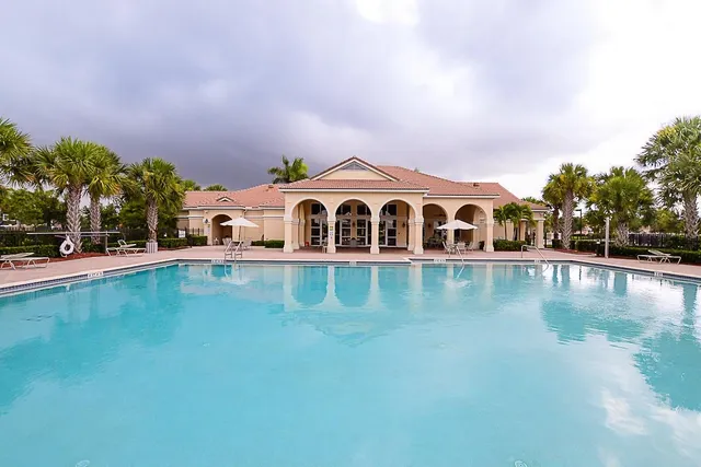 a view of pool with outdoor space and seating area