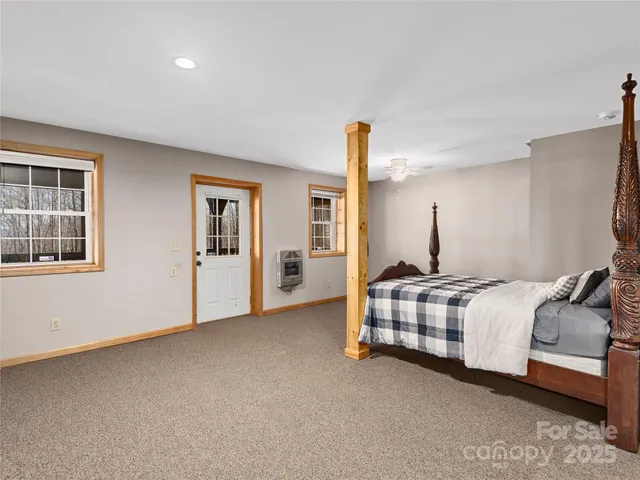 a bedroom with bed and window