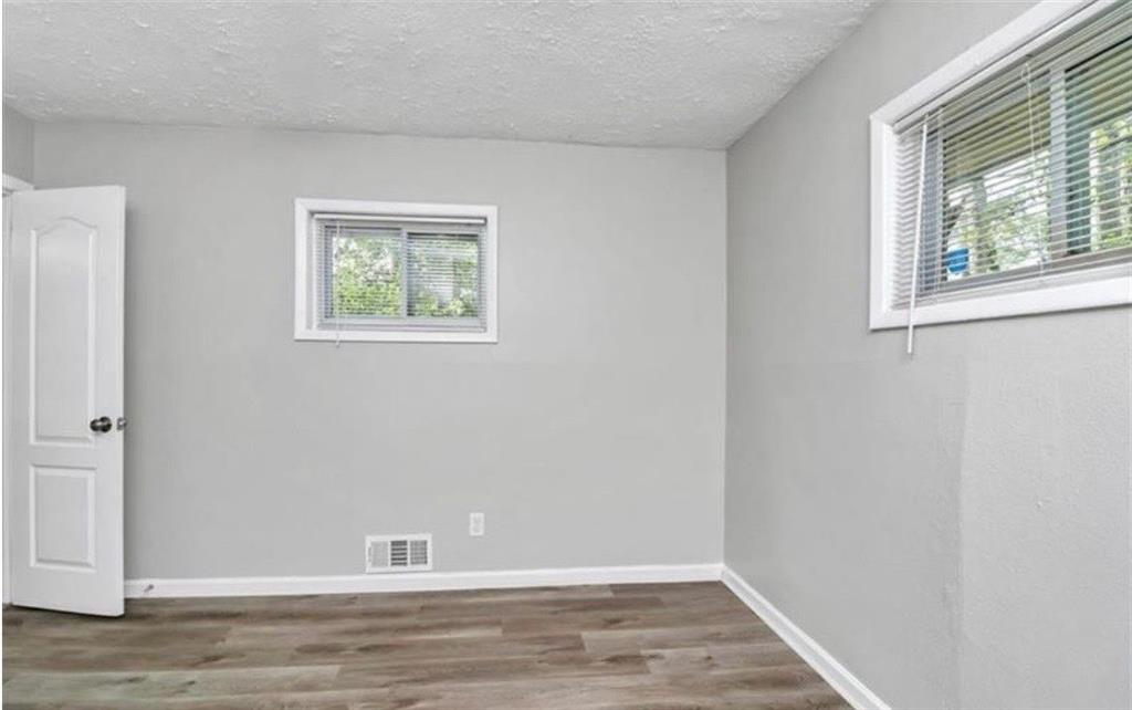 3711 Daisy Drive Decatur, GA 30032 - Photo 13 of 18 a view of room with window and hardwood floor