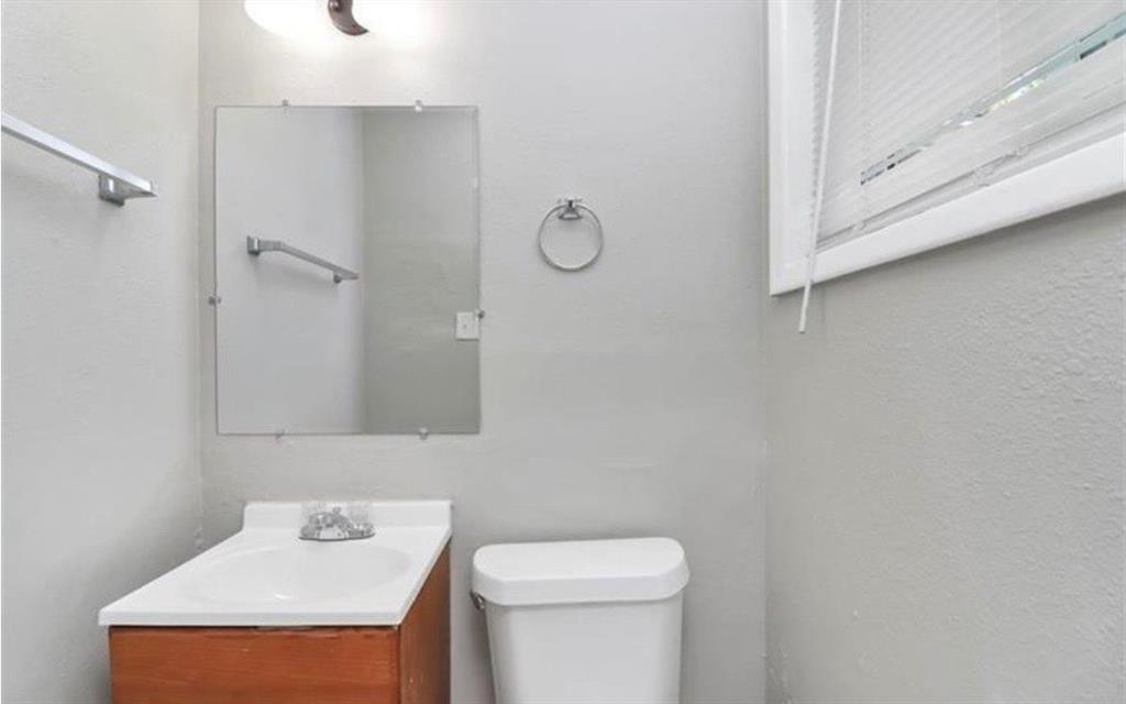 3711 Daisy Drive Decatur, GA 30032 - Photo 17 of 18 a bathroom with a sink a toilet and a mirror