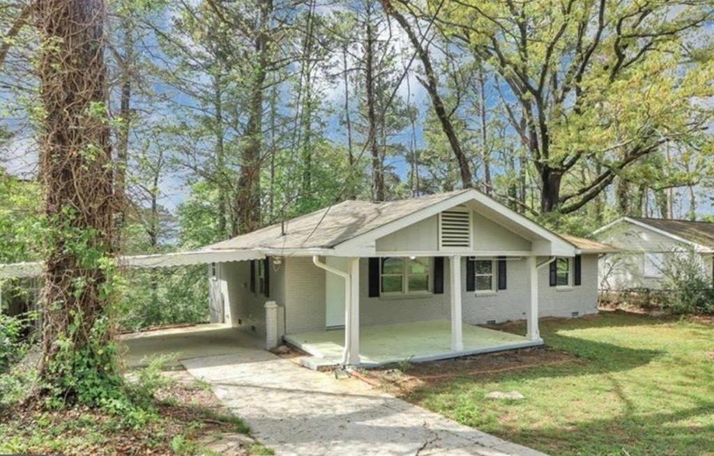 3711 Daisy Drive Decatur, GA 30032 - Photo 2 of 18 a view of a house with a yard