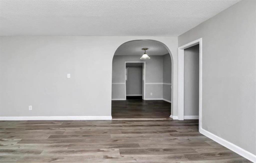 3711 Daisy Drive Decatur, GA 30032 - Photo 6 of 18 a view of a livingroom with wooden floor and staircase
