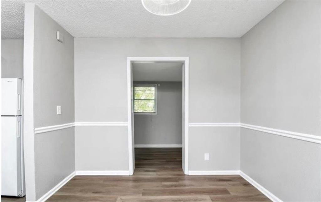 3711 Daisy Drive Decatur, GA 30032 - Photo 9 of 18 a view of an empty room with closet and wooden floor