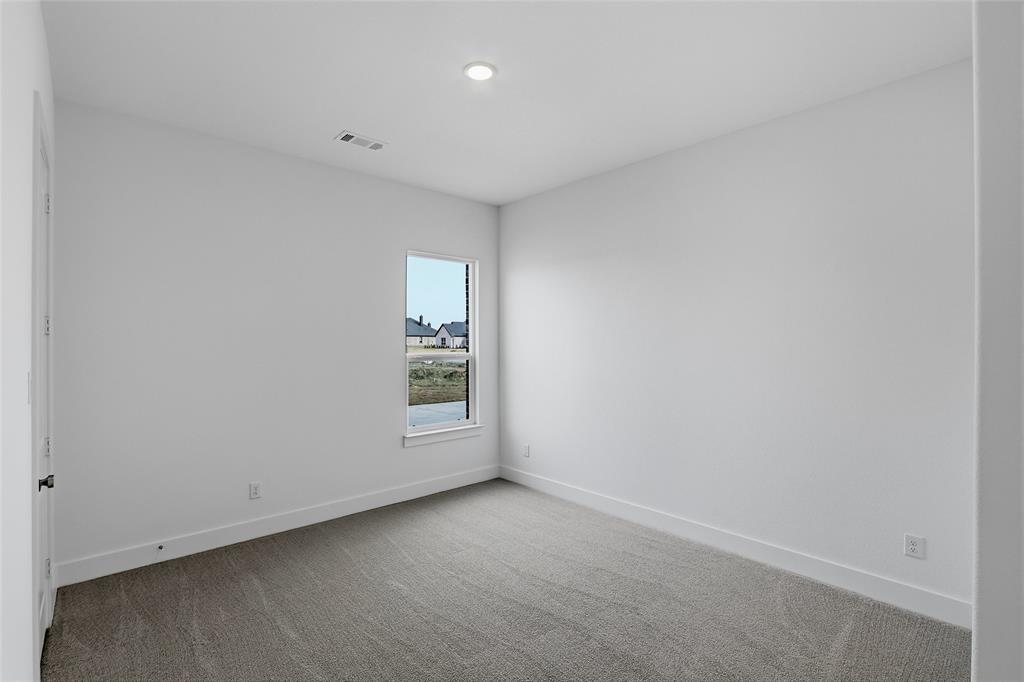 808 Vly Rdg Road Van Alstyne, TX 75495 - Photo 31 of 39 an empty room with a empty space and window