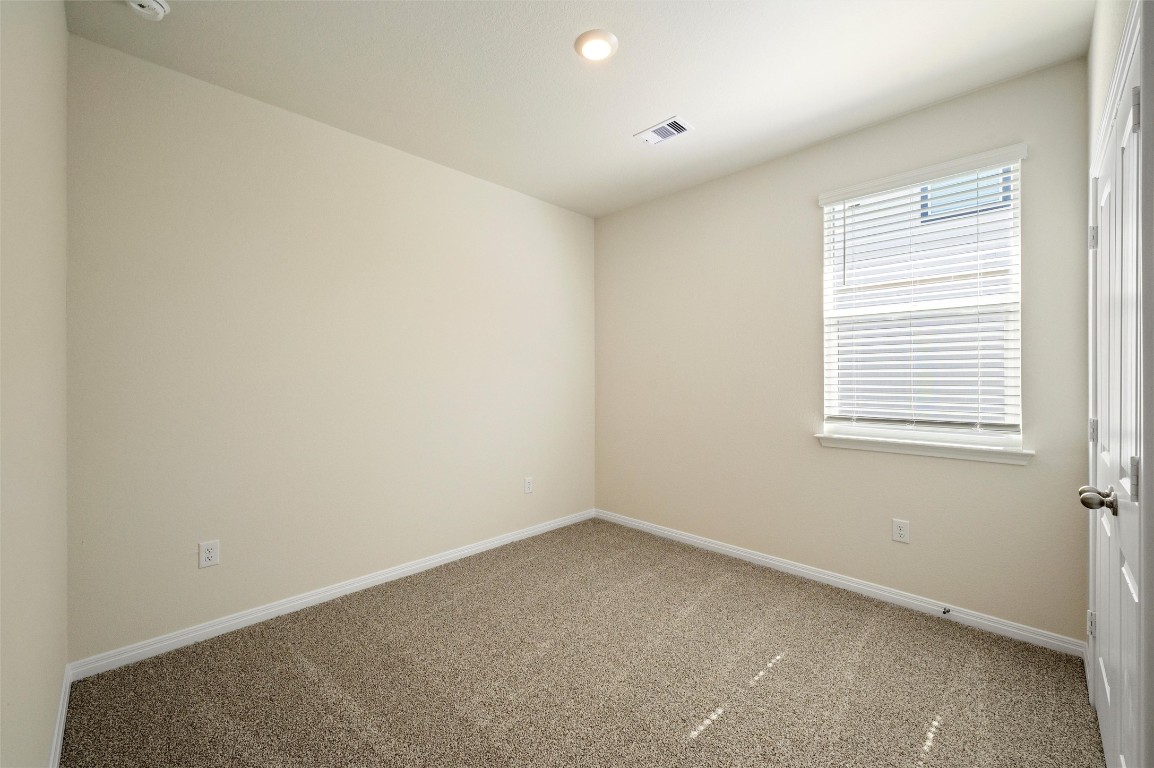 224 Kickapoo Lane Kyle, TX 78640 - Photo 21 of 31 Empty room featuring carpet and recessed lighting