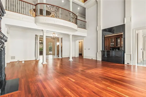 a living room with furniture and a chandelier