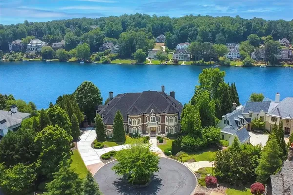 a view of a lake with a house in the background