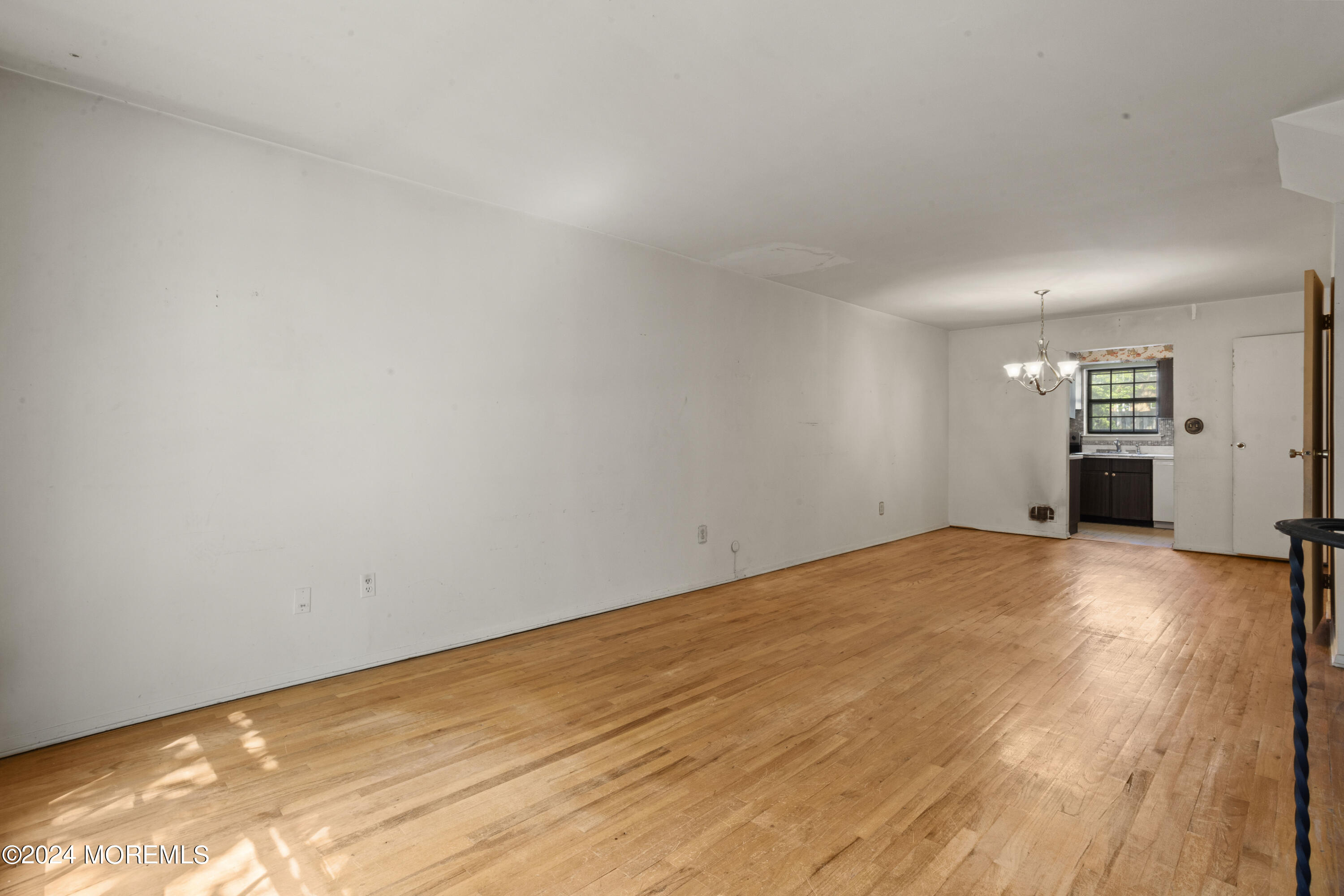 301 Spring Street, Unit 30 Red Bank, NJ 07701 - Photo 4 of 23 a view of empty room with wooden floor