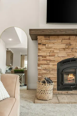 a view of a livingroom with entryway and workspace