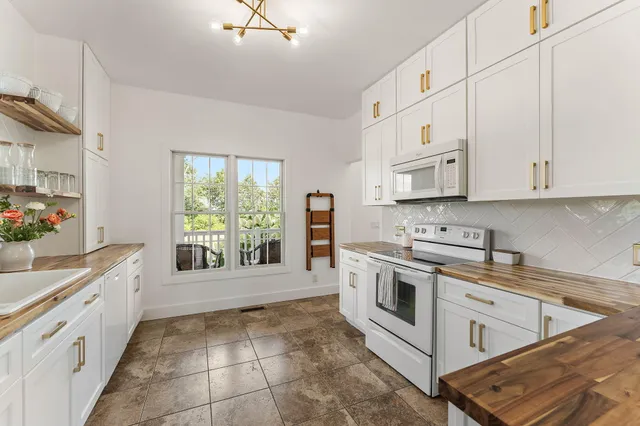 a view of front door with wooden floor