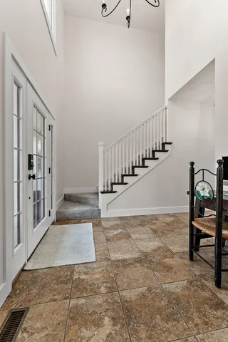 a bathroom with a shower and a mirror