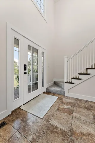 a bed room with a bed and a chandelier