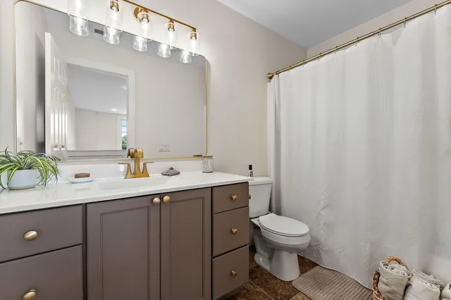 a bed room with a bed and a large window