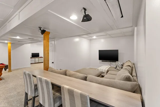 a view of a house with a yard and sitting area