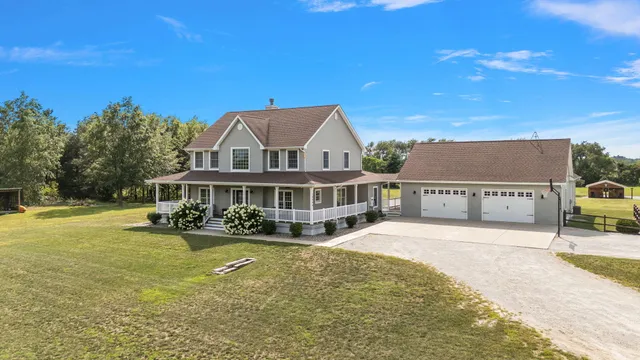 a view of a dining room with furniture wooden floor and a chandelier