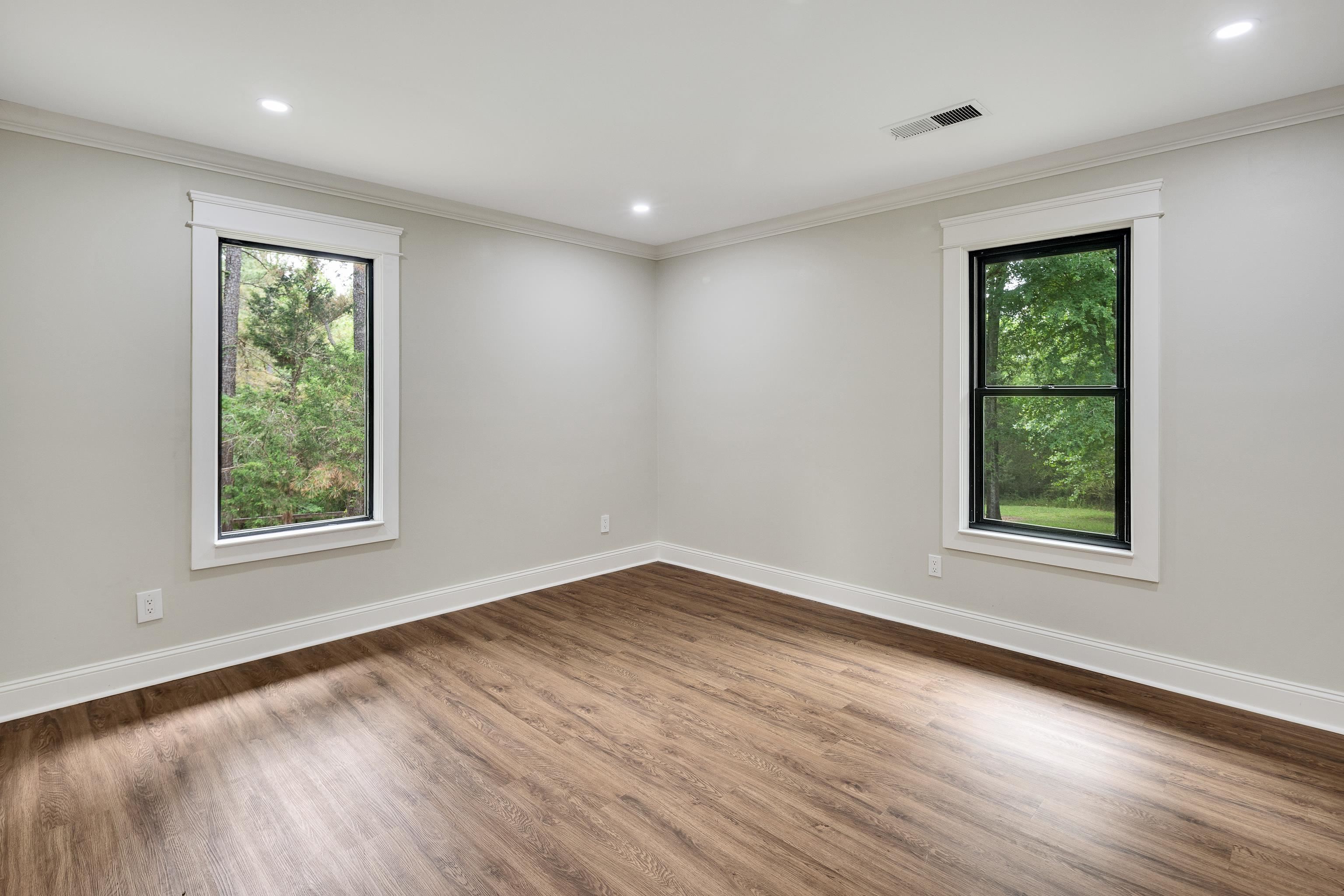 10470 Raleigh Lagrange Road East Eads, TN 38028 - Photo 22 of 40 a view of an empty room with wooden floor and a window
