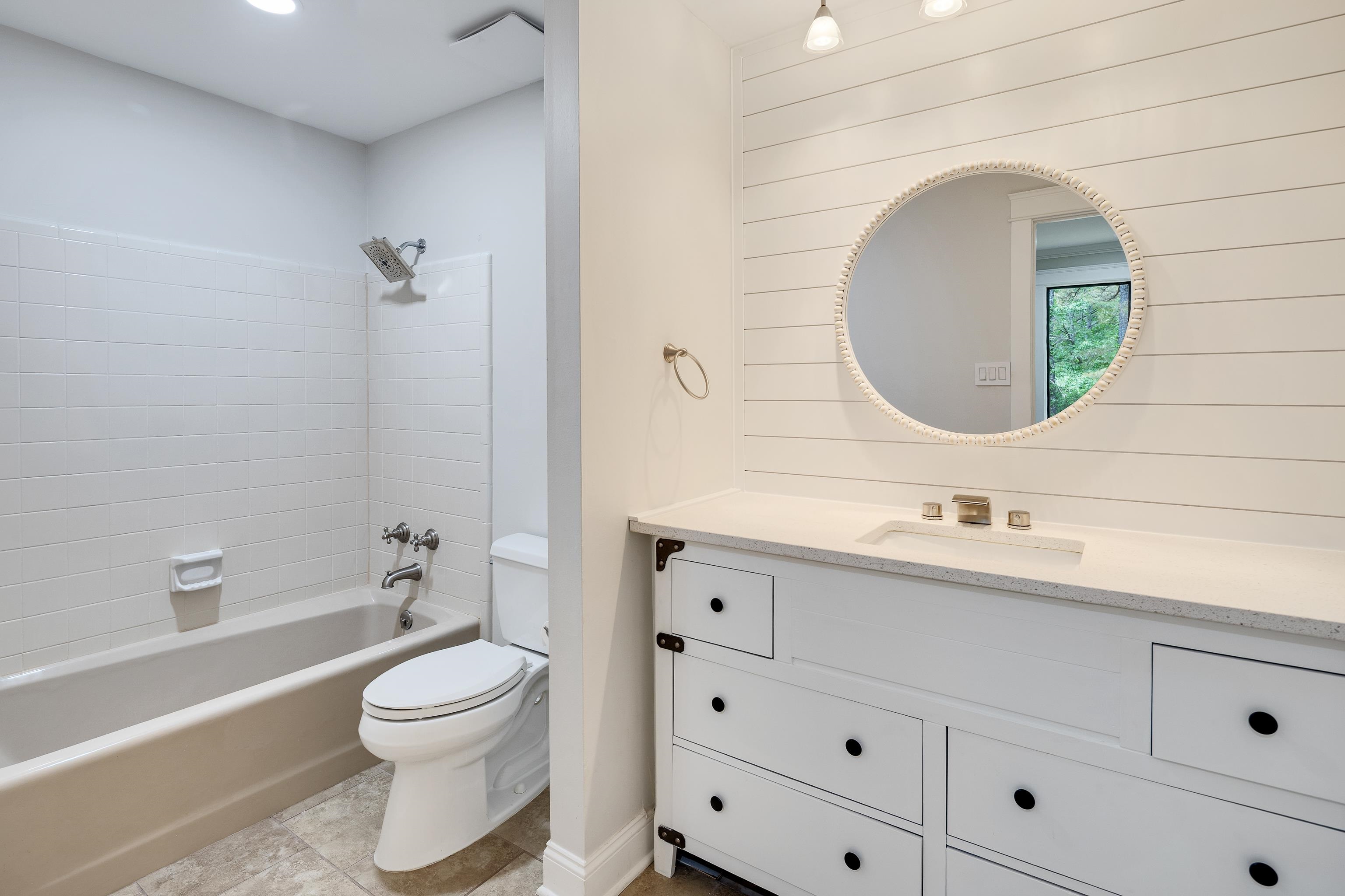 10470 Raleigh Lagrange Road East Eads, TN 38028 - Photo 23 of 40 a bathroom with a toilet sink vanity tub and mirror