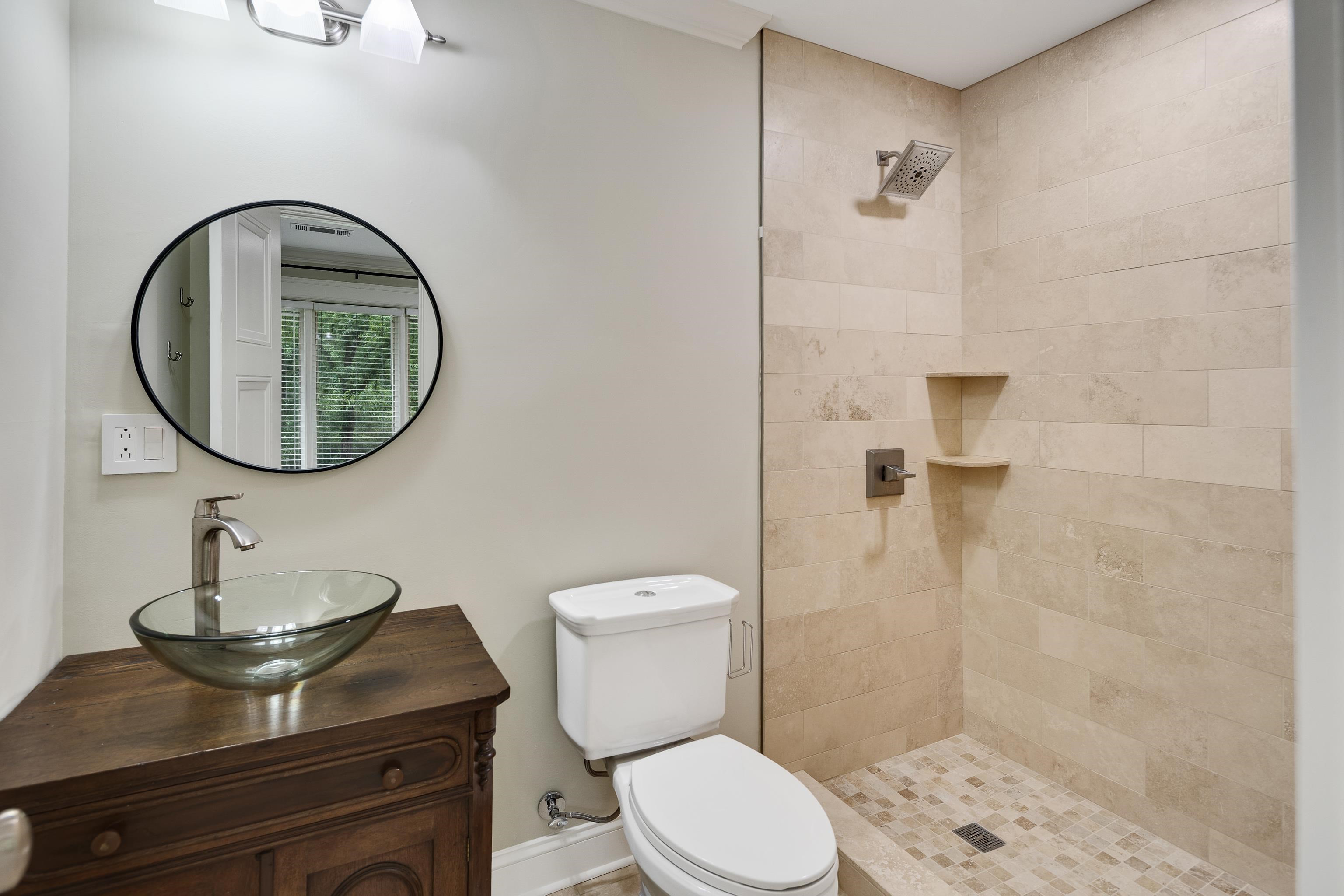 10470 Raleigh Lagrange Road East Eads, TN 38028 - Photo 26 of 40 a bathroom with a toilet a sink and a mirror