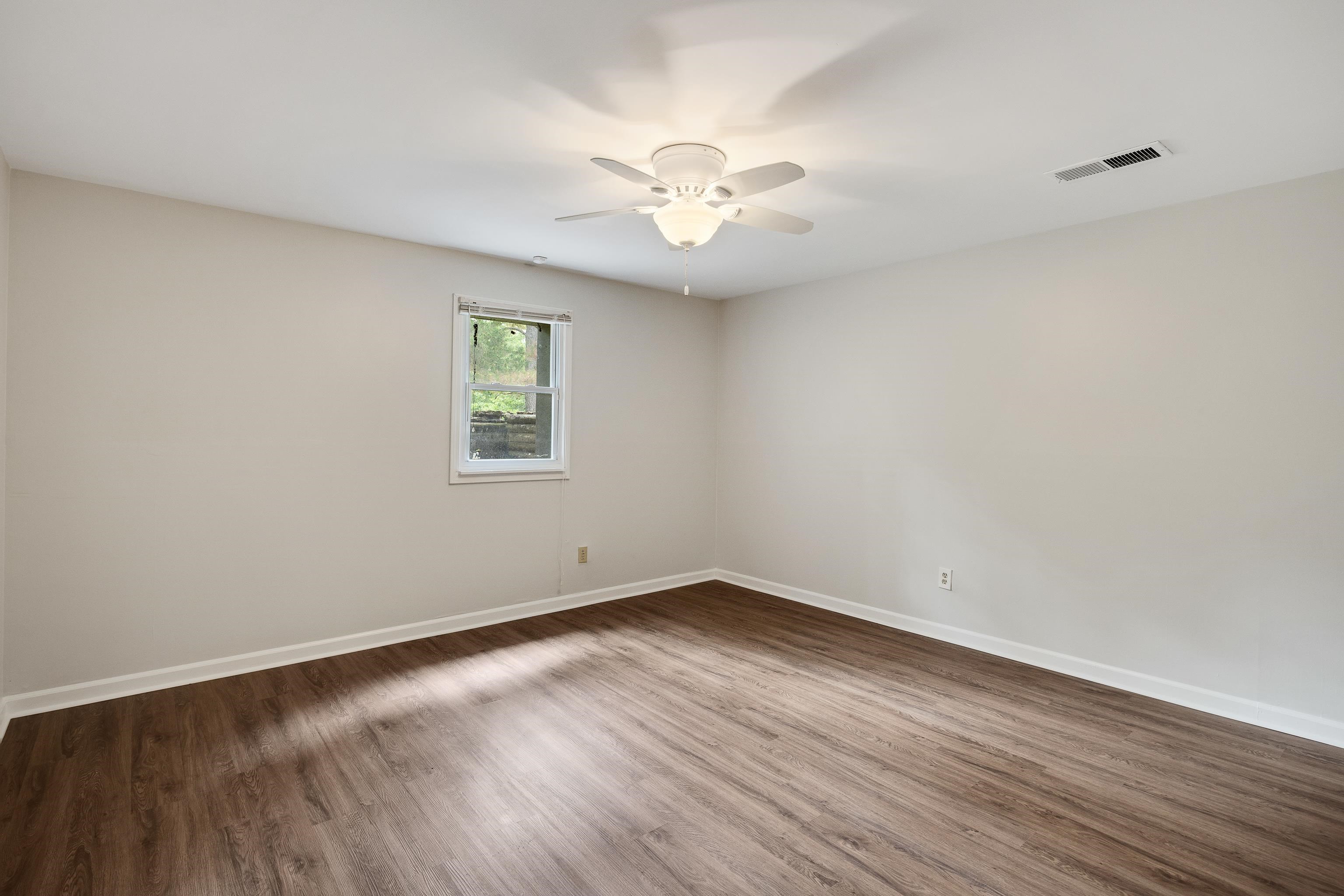 10470 Raleigh Lagrange Road East Eads, TN 38028 - Photo 30 of 40 a view of a room with wooden floor and a window