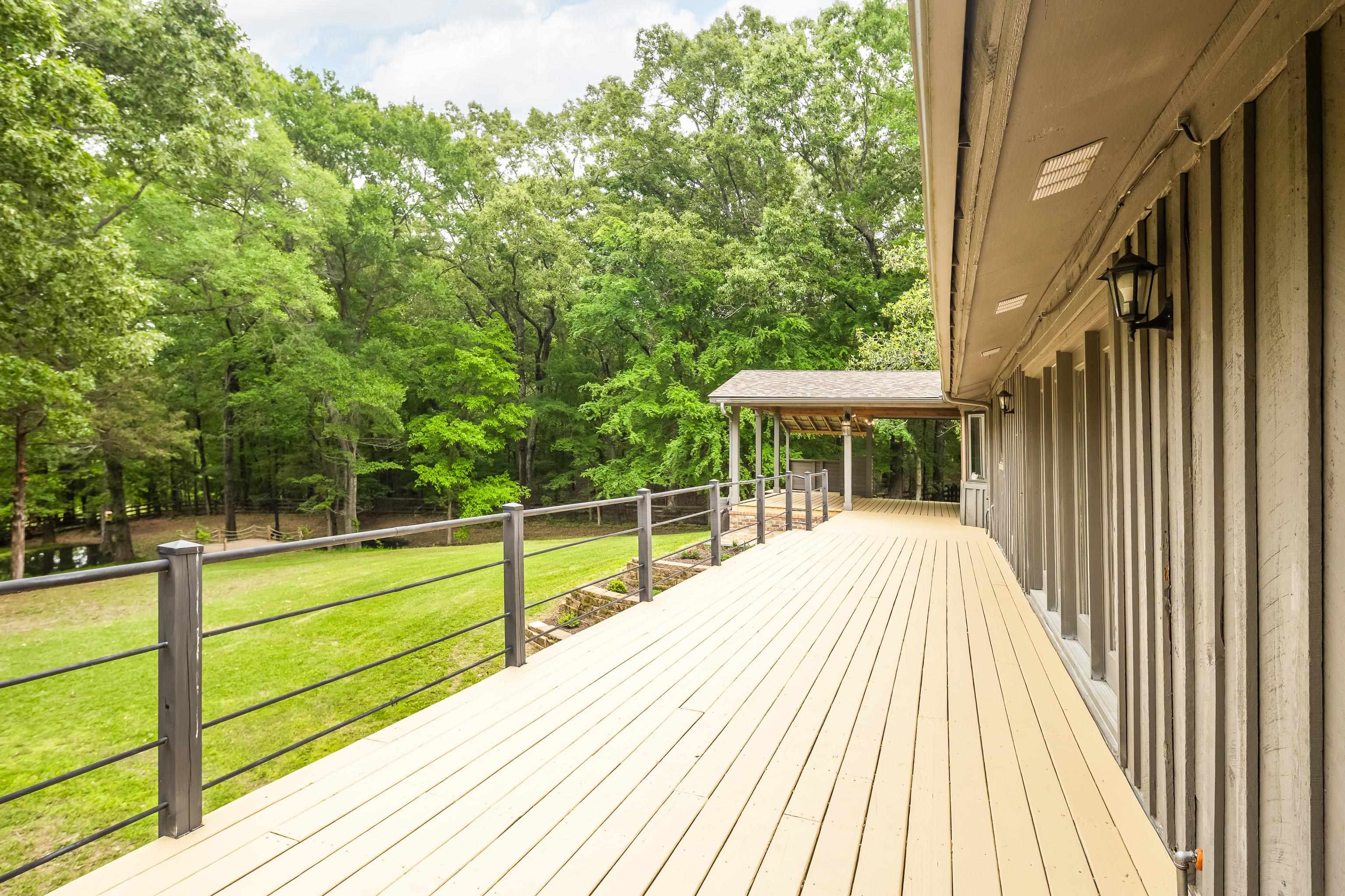 10470 Raleigh Lagrange Road East Eads, TN 38028 - Photo 35 of 40 a view of a patio with a table and chairs