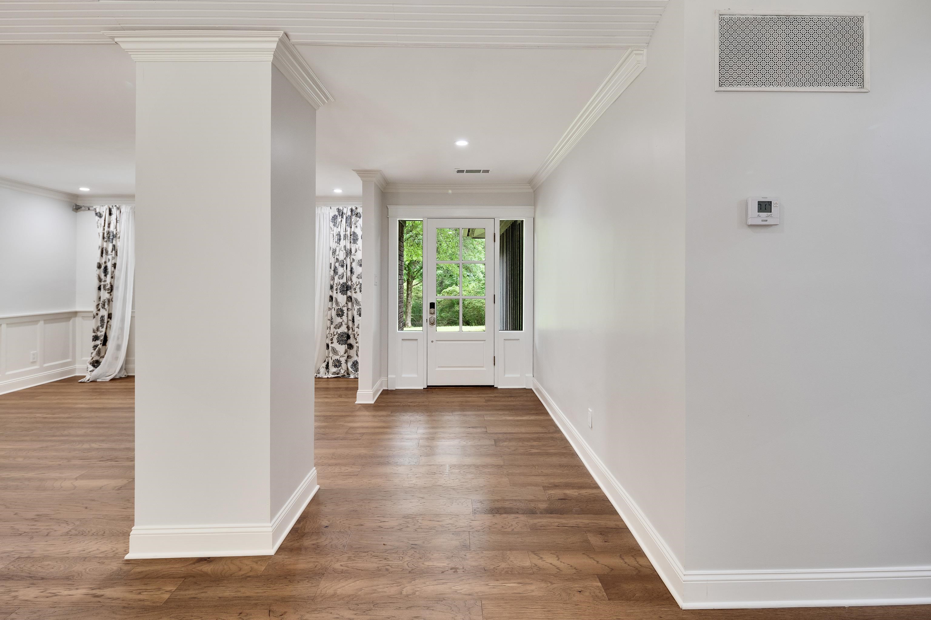 10470 Raleigh Lagrange Road East Eads, TN 38028 - Photo 5 of 40 a view of a hallway with wooden floor and a window