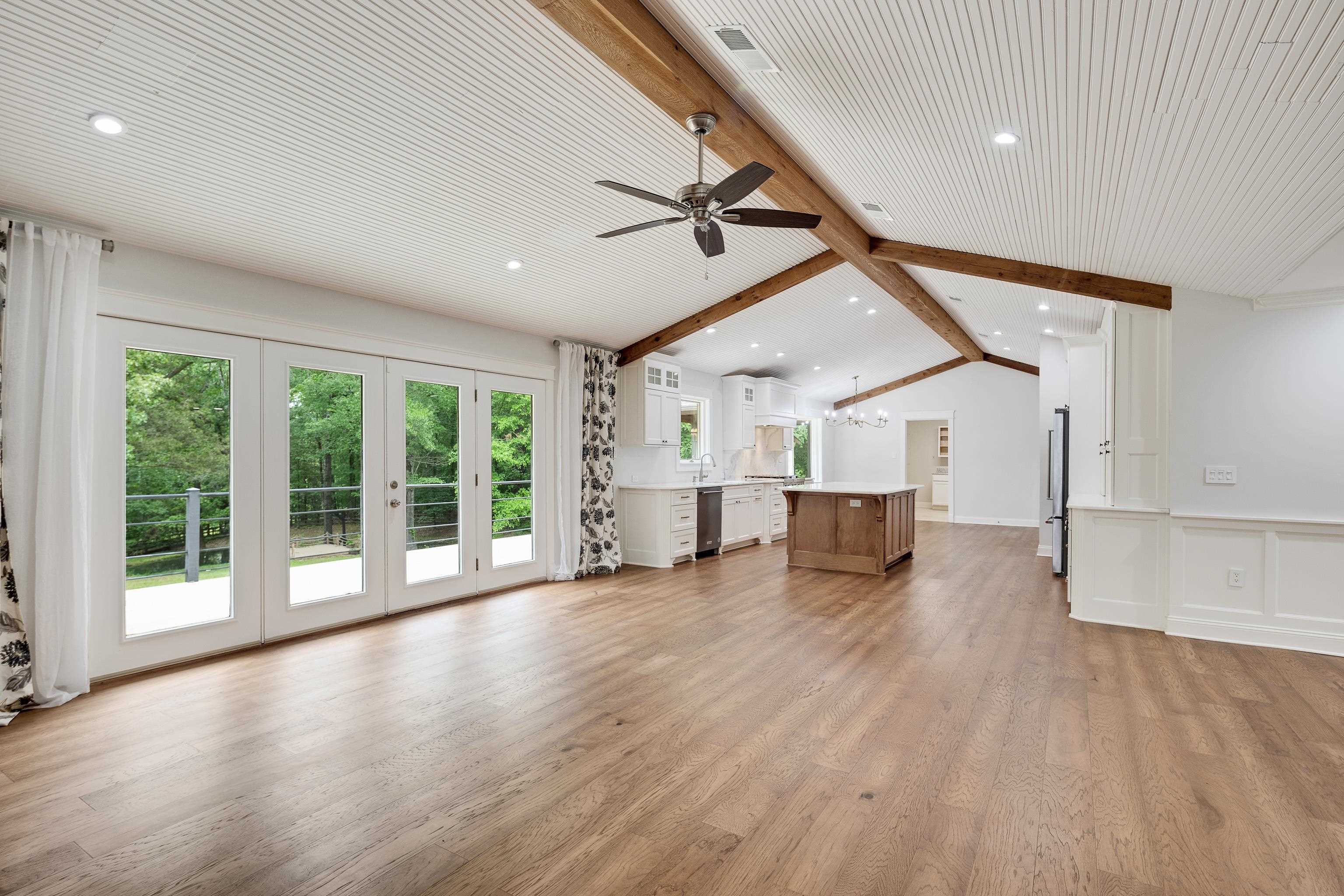 10470 Raleigh Lagrange Road East Eads, TN 38028 - Photo 10 of 40 a view of empty room with wooden floor and fan
