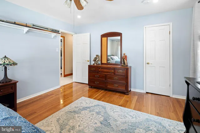 a room with a dresser and a mirror