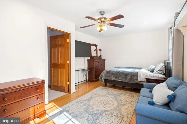 a bedroom with a bed and cabinets