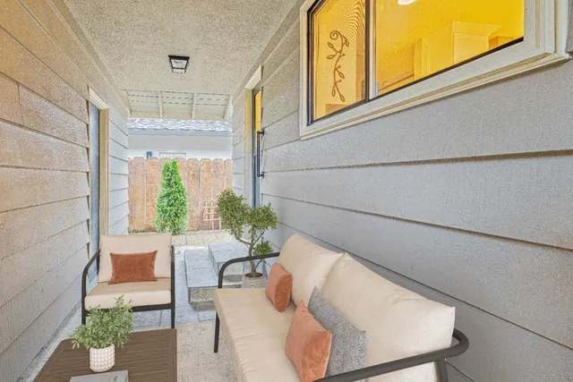 a view of balcony with furniture