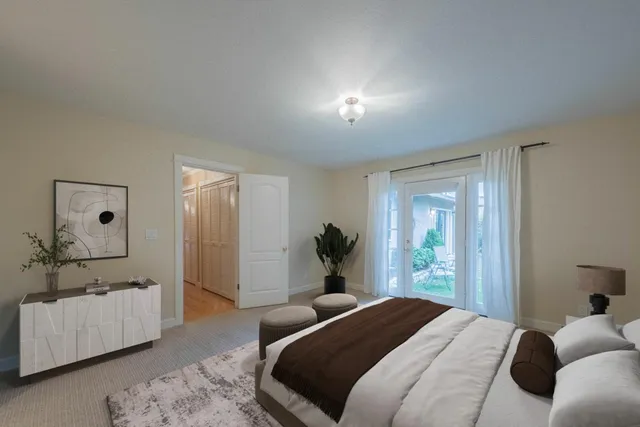 a bedroom with a bed and a couch