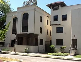 a front view of a house with garage and windows