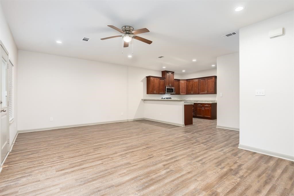 910 Shady Lane, Unit B Conroe, TX 77301 - Photo 12 of 18 a view of kitchen with microwave and stove