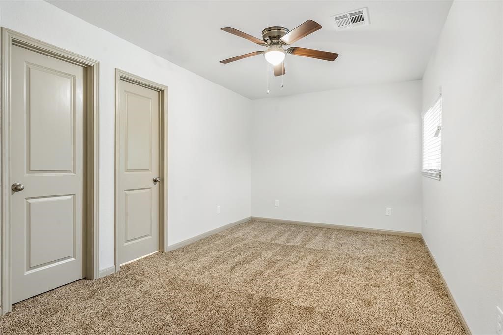 910 Shady Lane, Unit B Conroe, TX 77301 - Photo 13 of 18 an empty room with chandelier fan