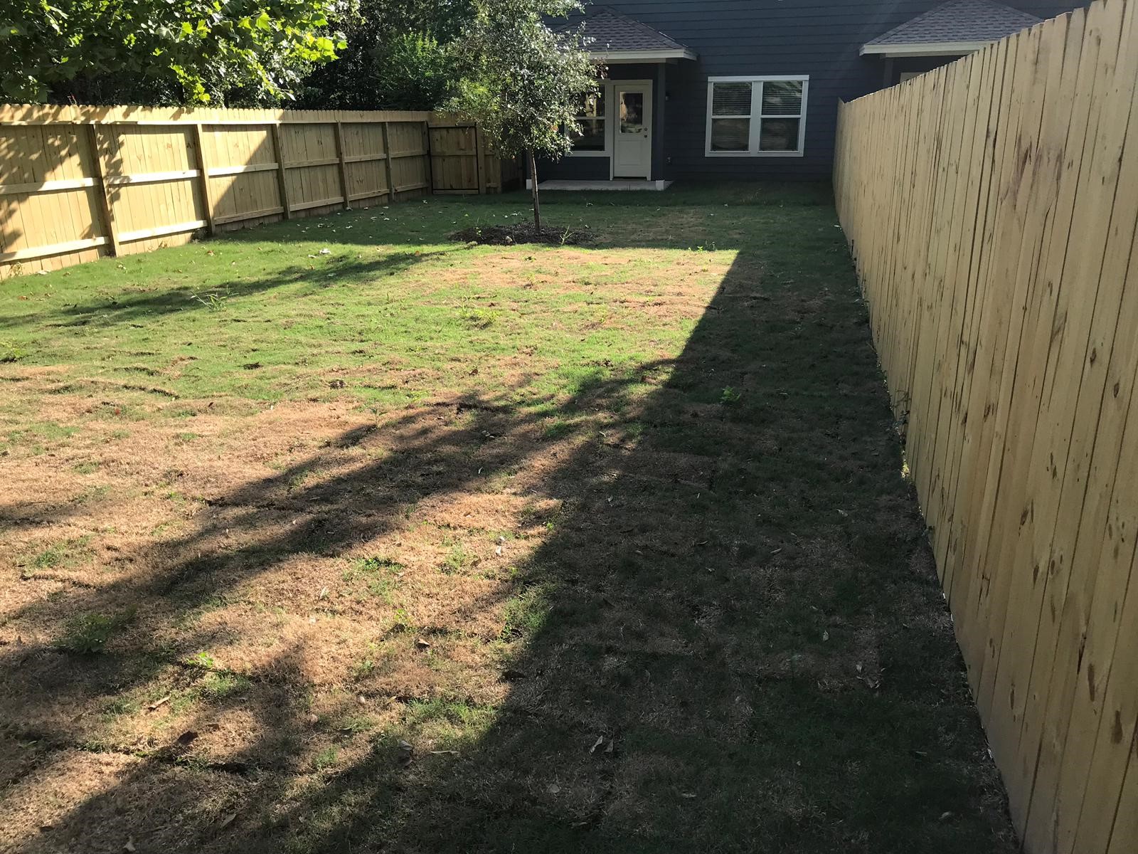 910 Shady Lane, Unit B Conroe, TX 77301 - Photo 18 of 18 a view of a backyard