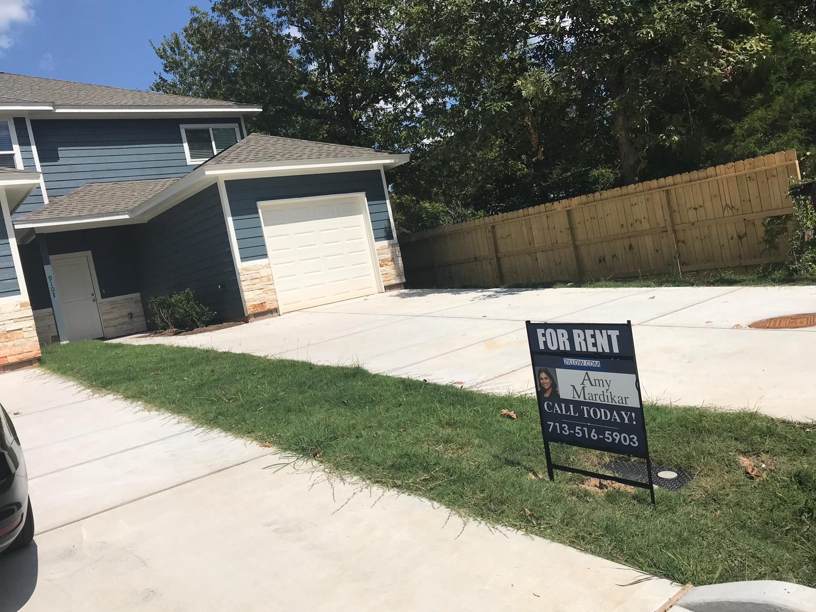 910 Shady Lane, Unit B Conroe, TX 77301 - Photo 2 of 18 a sign board with a yard