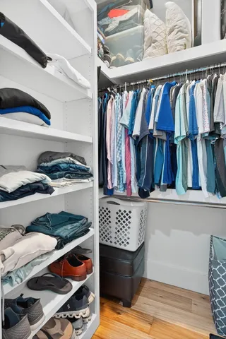 a bathroom with a double vanity sink a mirror and a bathtub