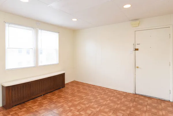 a view of an empty room with a window