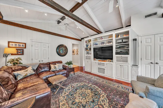 a bath tub sitting in a bathroom next to a window