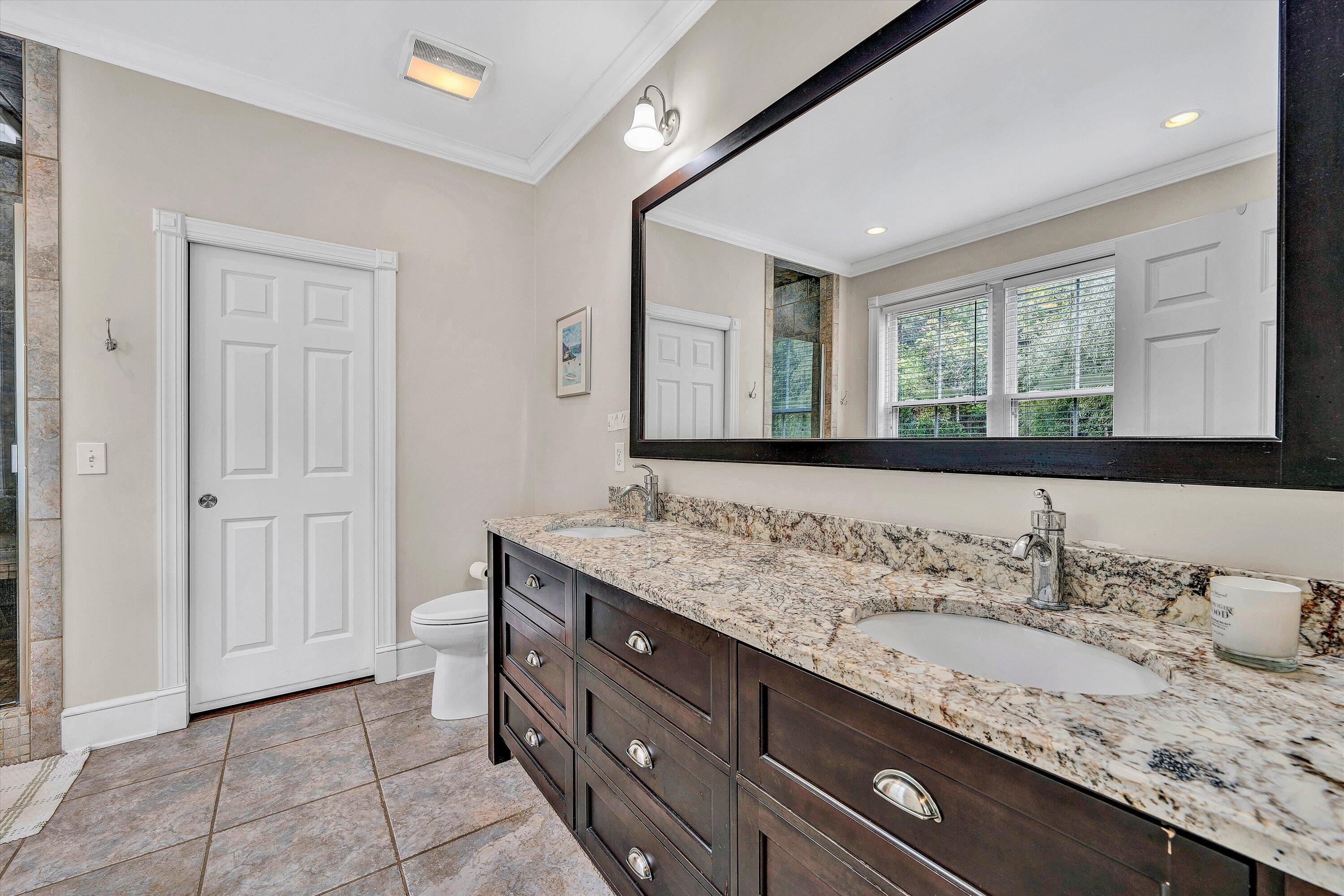 400 Walnut Road Salem, VA 24153 - Photo 54 of 97 a bathroom with a granite countertop sink and a mirror