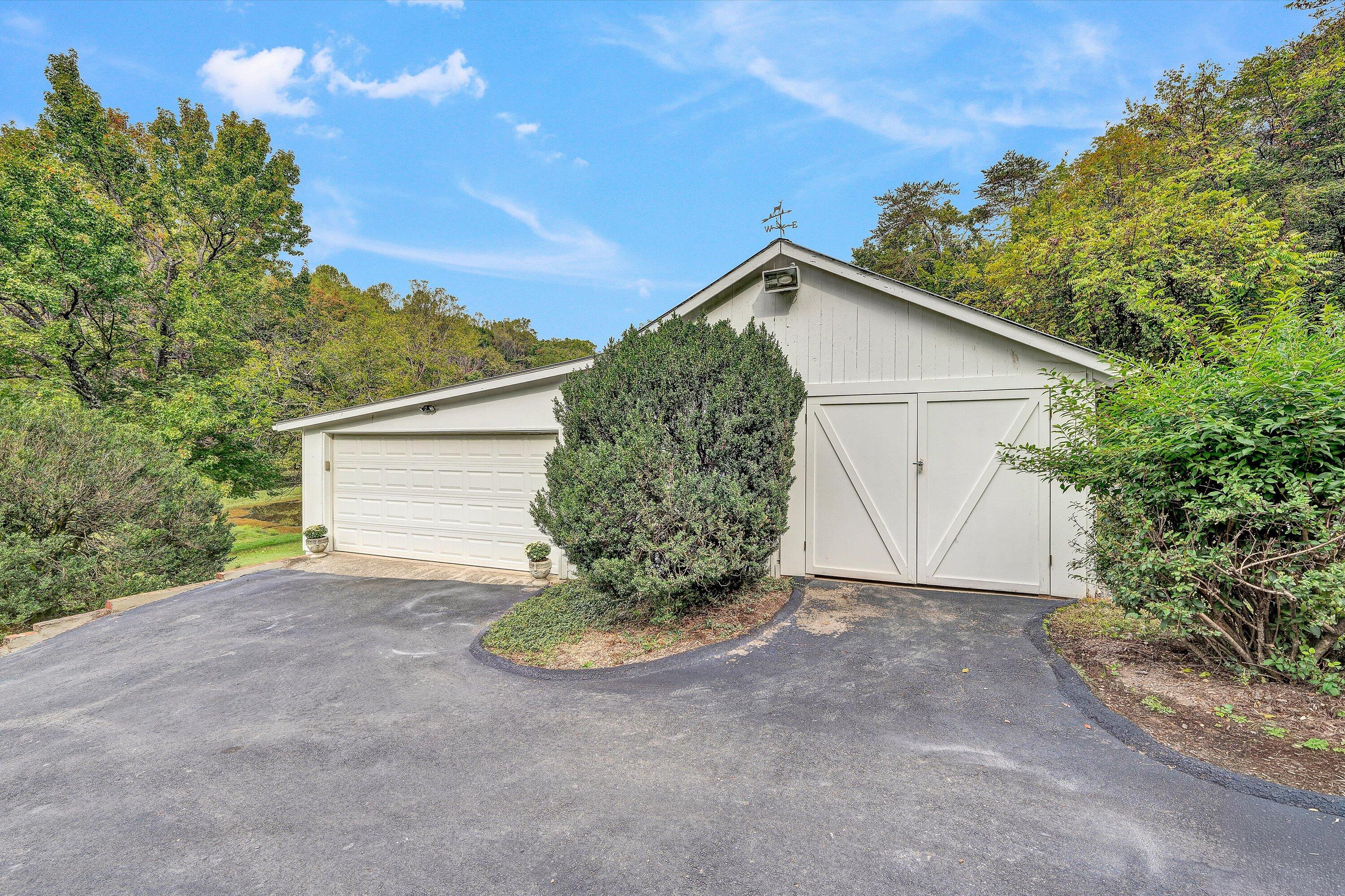 400 Walnut Road Salem, VA 24153 - Photo 75 of 97 a view of a house with a yard and garage