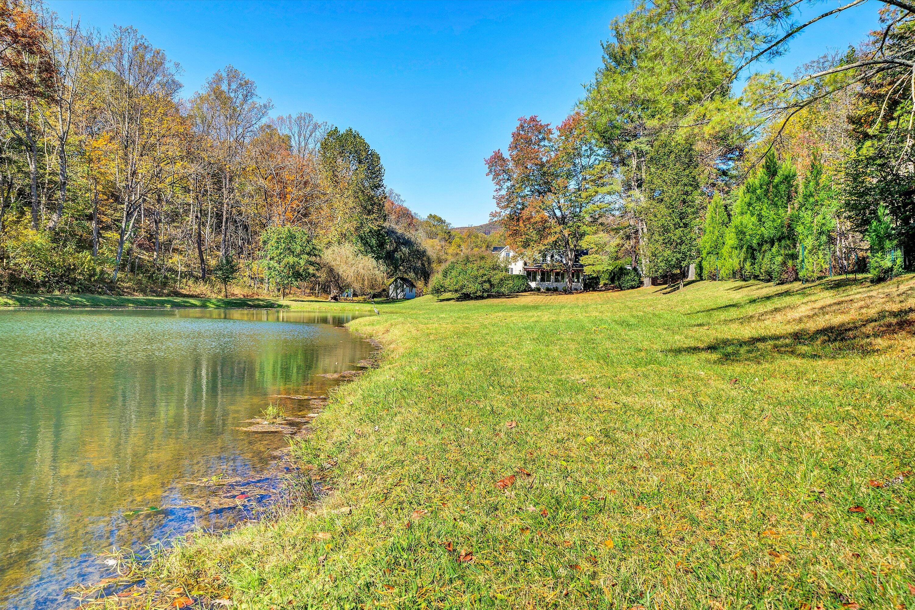 400 Walnut Road Salem, VA 24153 - Photo 89 of 97 a view of a lake with a yard