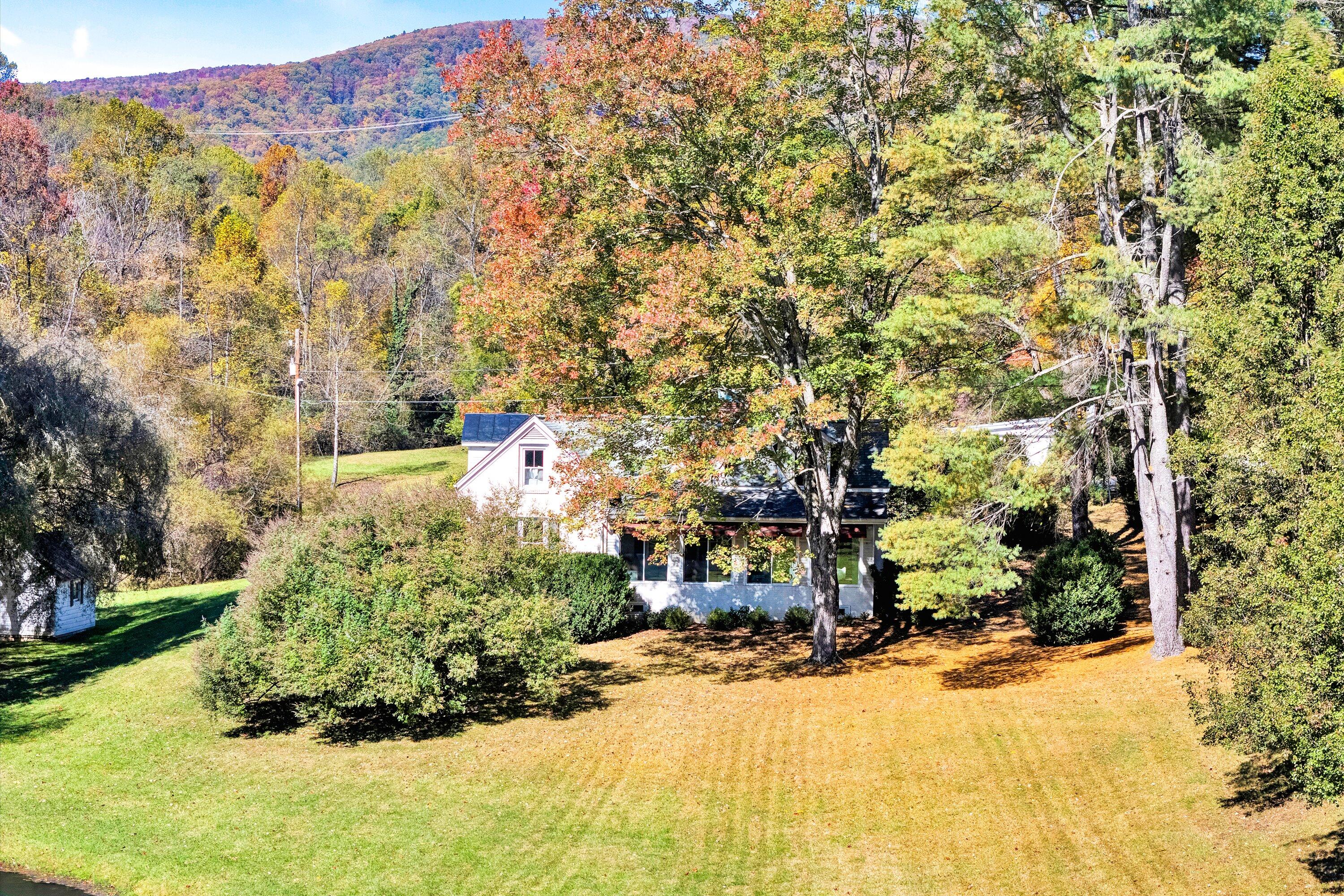 400 Walnut Road Salem, VA 24153 - Photo 92 of 97 a view of a garden with a building in the background