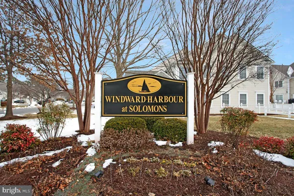 a view of a street with a building and trees